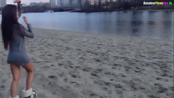 Brunette shameless naked near the river