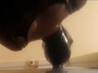 High-Heeled Milf Sucks and Fucks in a Catsuit at a Gloryhole