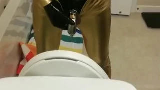 Peeing through chastity in catsuits